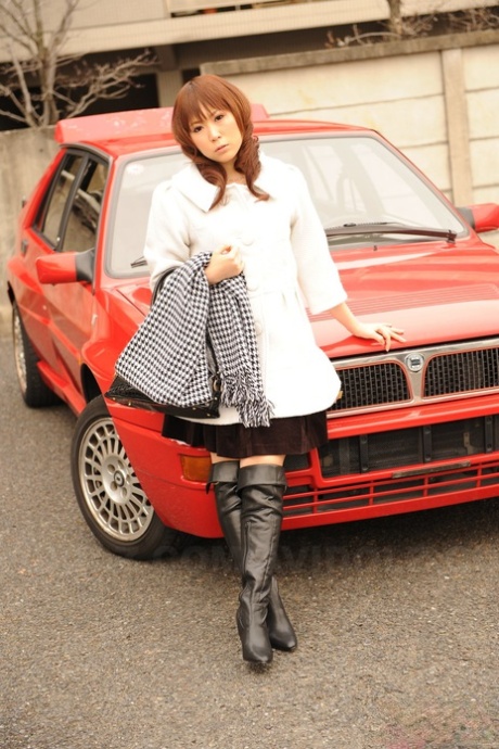 Japanese model Yuko Morita shows some leg while clothed in black boots 21979856